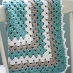 white grey and eggshell blue crochet blanket