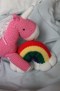 Reuben the Pink Fluffy Unicorn Dancing on a Rainbow