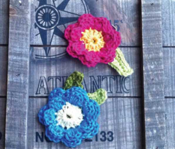 Flower Hair Clips Free Crochet Pattern. Easy to crochet flower clips that look beautiful, the perfect accessory for ladies and girls, make as many as you want in different colors.