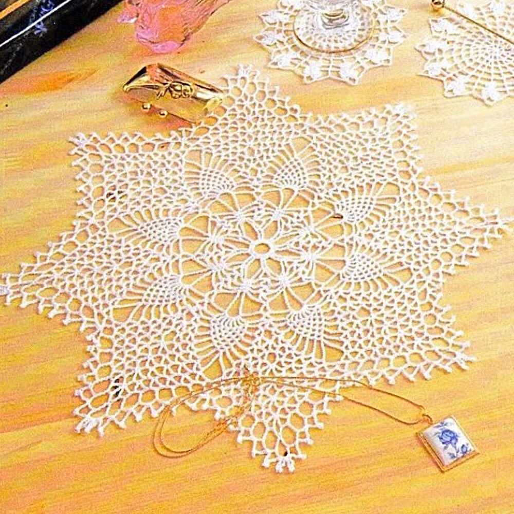 Small lacy star shaped doily