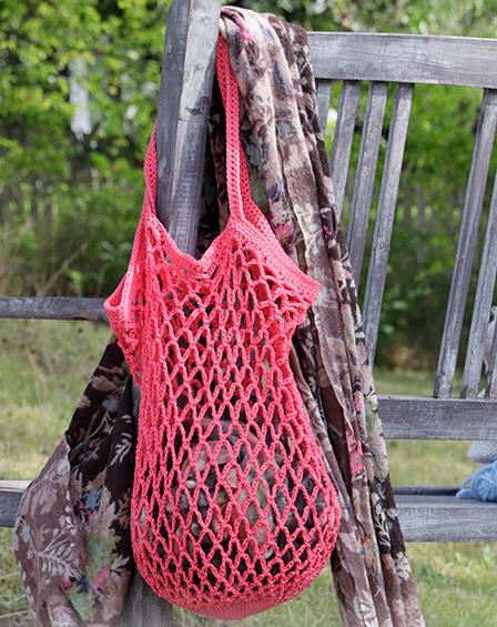 Crocheted shopping net/tote bag with chain-spaces. Piece is crocheted bottom up