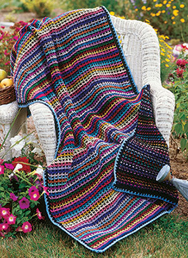 Free crochet pattern for a reversible throw with a rainbow theme