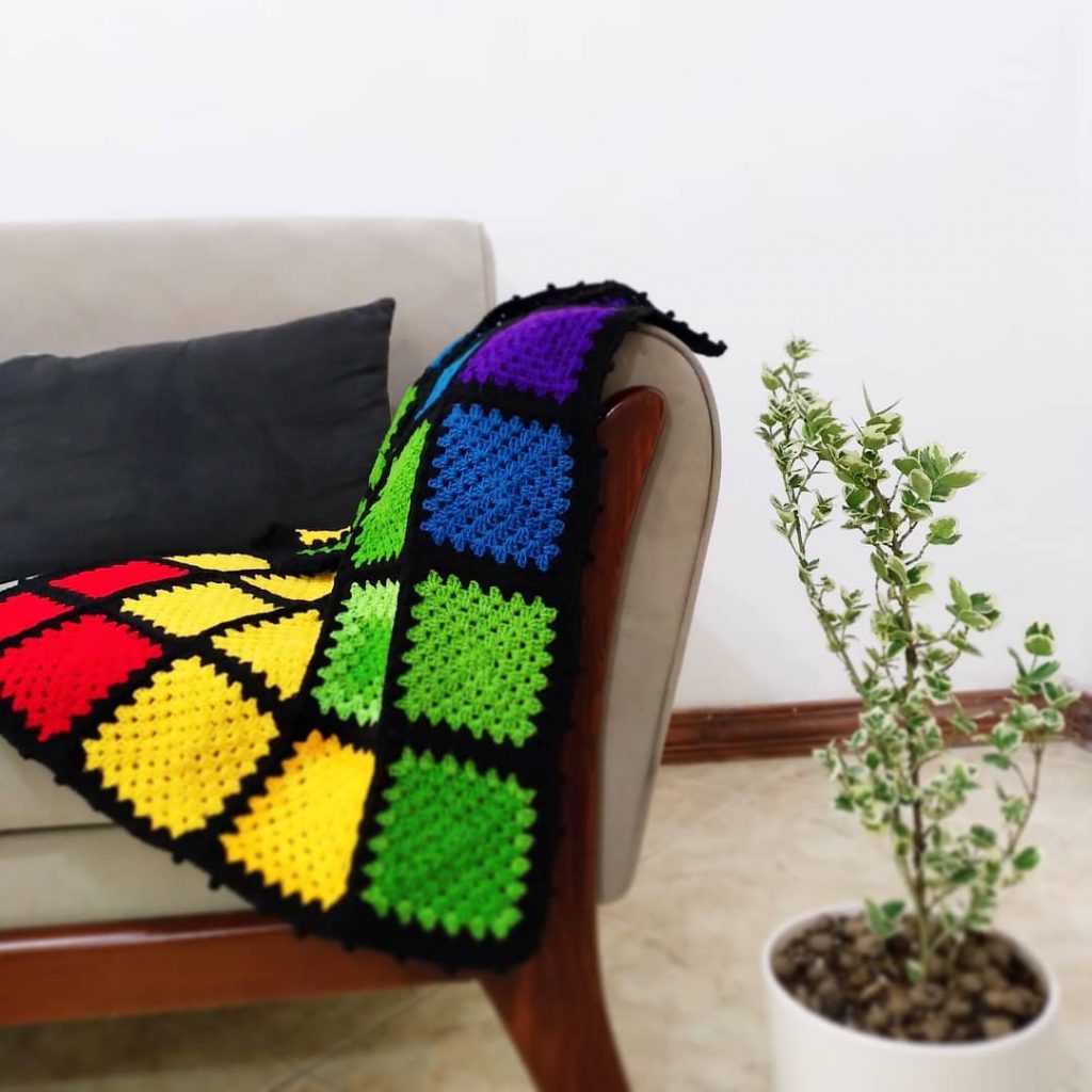 rainbow crochet granny square blanket with black border