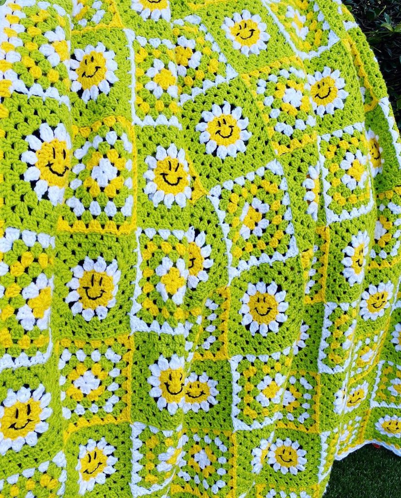 Bright green with yellow and white crochet granny square blanket