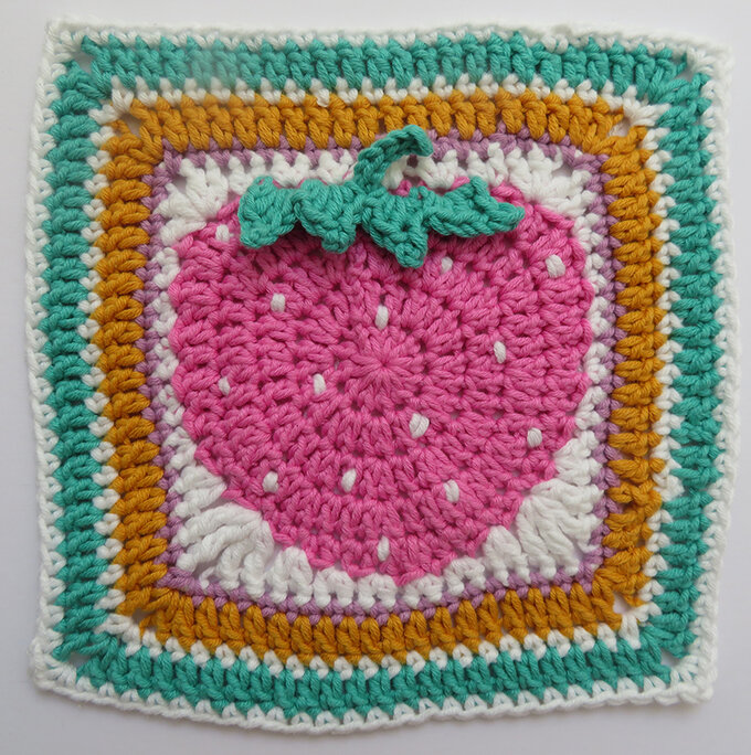 Crochet square with a strawberry theme