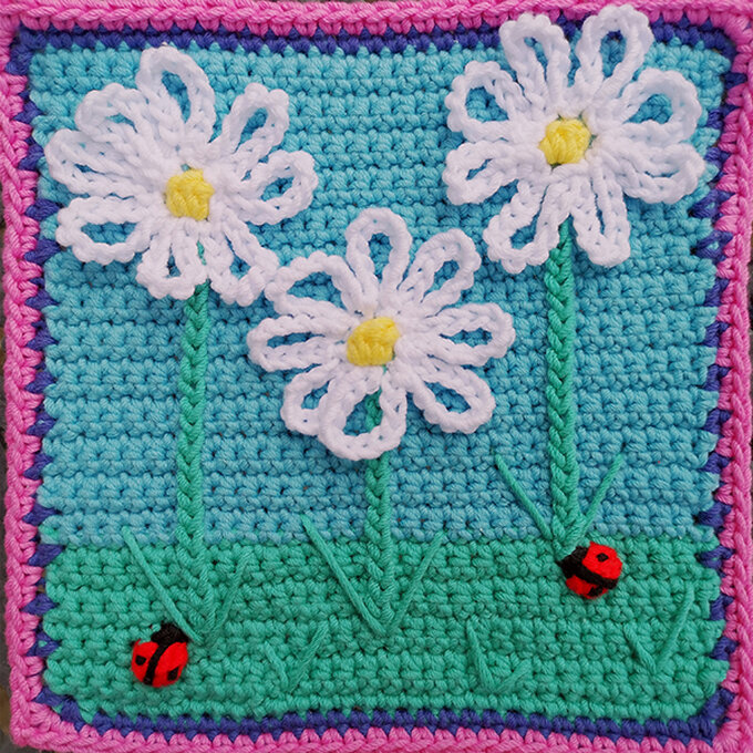 Crochet square with blue skies, daisies and ladybugs