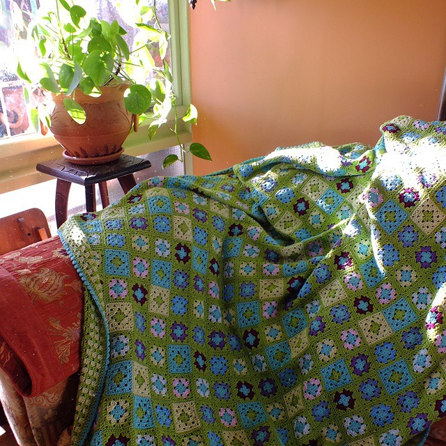 Granny square blanket in green and blue