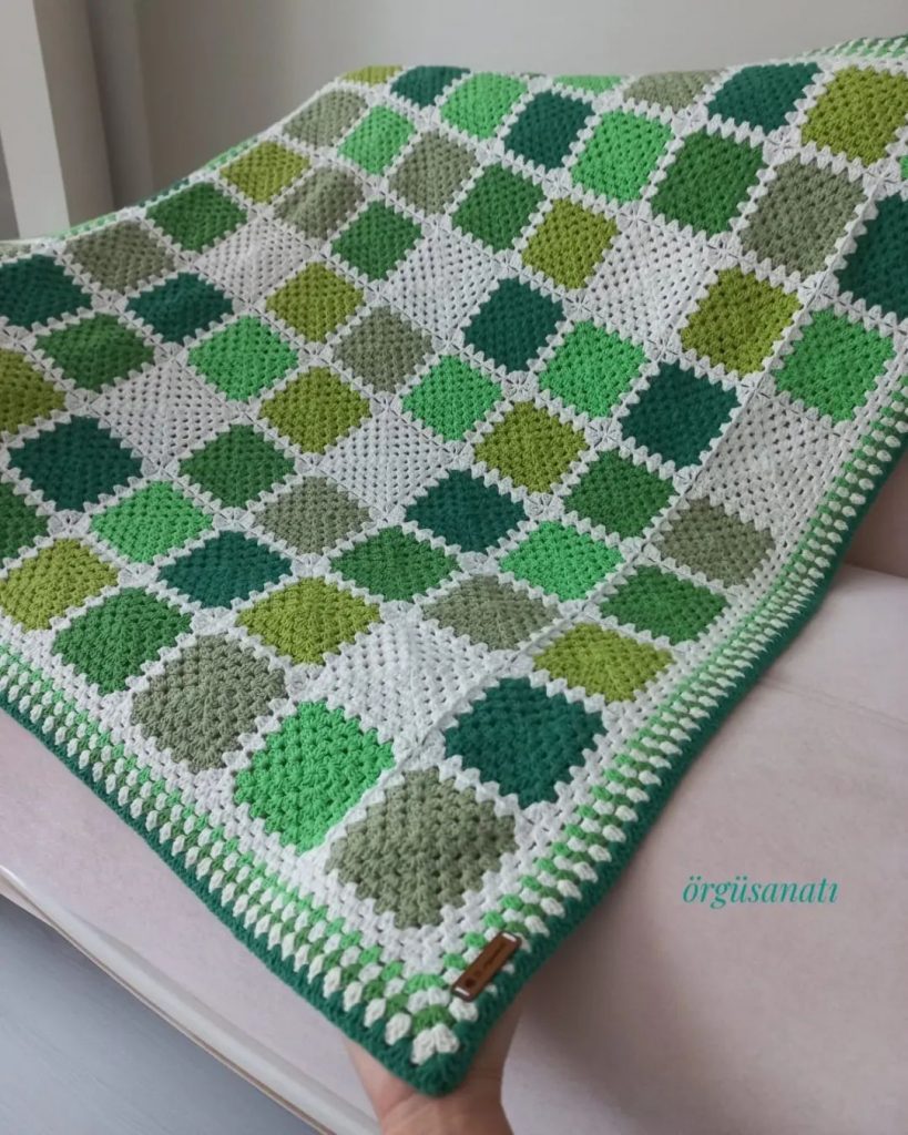 Green crochet blanket with granny squares